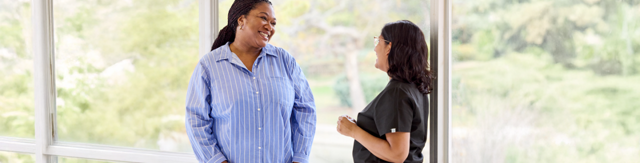 Woman speaking with healthcare provider.